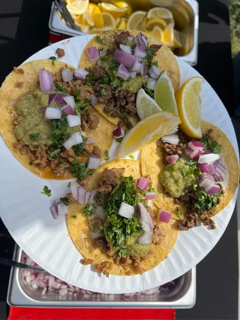 an image of a taquero with tacos